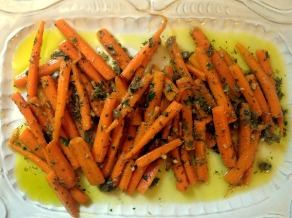 Sweet carrots slowly braised in olive oil and a bit of water and finished off with salty capers - I call these, "carrots, elevated"